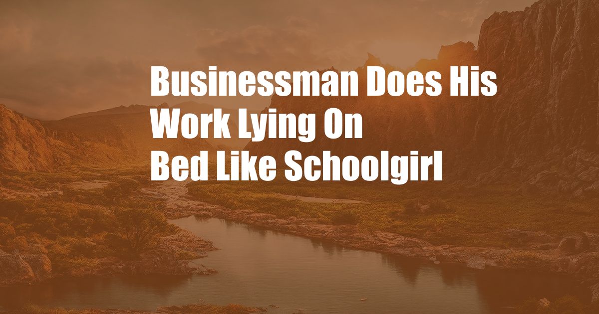 Businessman Does His Work Lying On Bed Like Schoolgirl