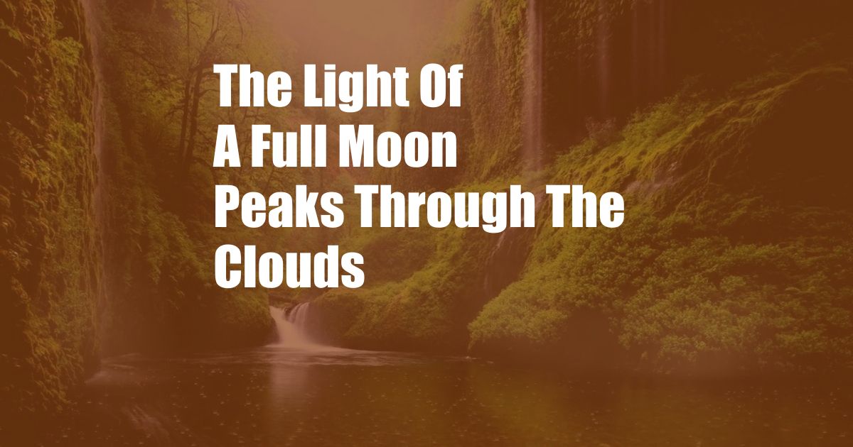 The Light Of A Full Moon Peaks Through The Clouds